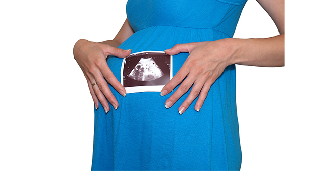pregnant-woman-holds-picture-ultrasonography-child