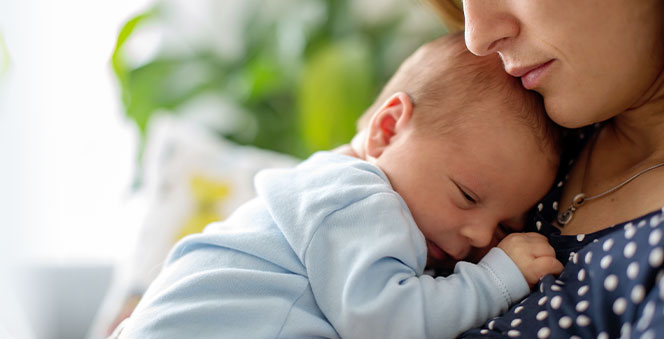 mother holding tenderly