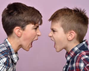 Siblings fight for attention