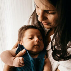 Newborn in mom's arms Newborn in mom's arms